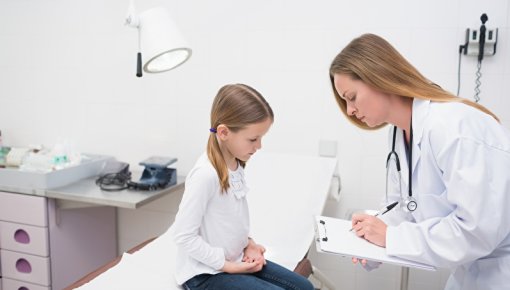 Photo of a girl and a doctor